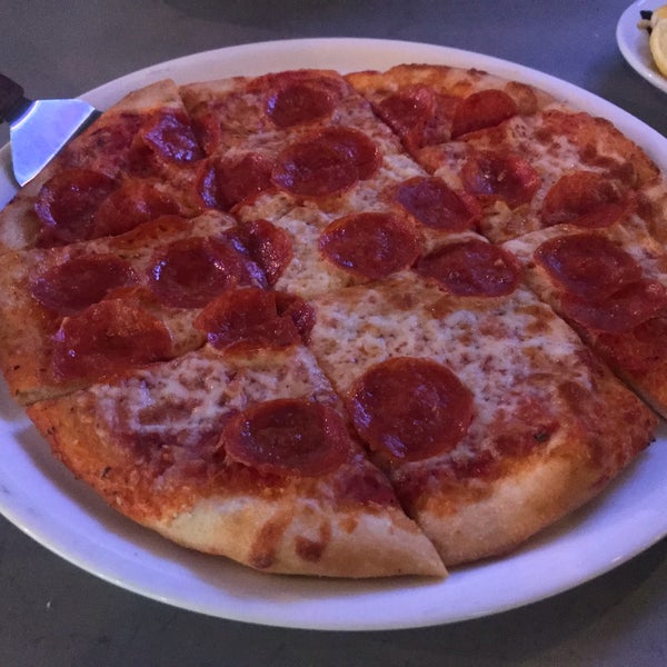 Photo taken at Giuseppe&#39;s Pizzeria by amy l. on 12/23/2019