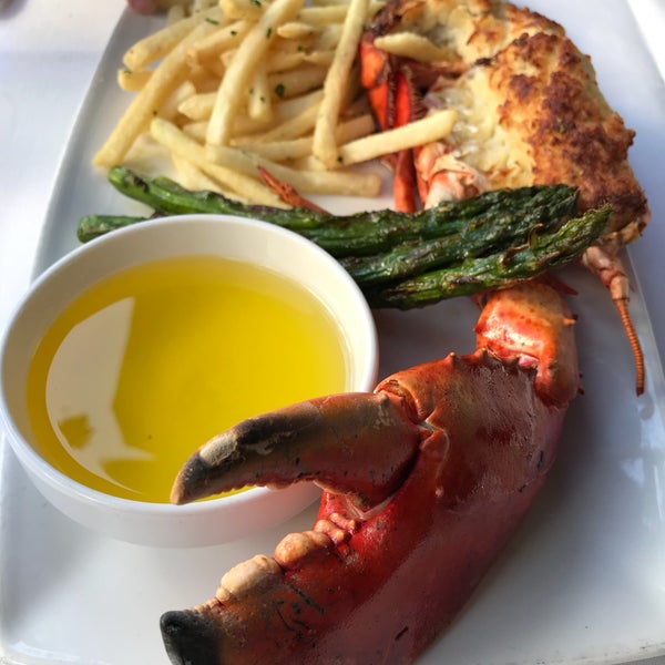 Photo taken at Blue Point Coastal Cuisine by amy l. on 5/29/2018