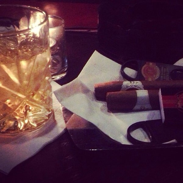 Photo taken at Merchants Cigar Bar by Khalifa A. on 7/31/2014