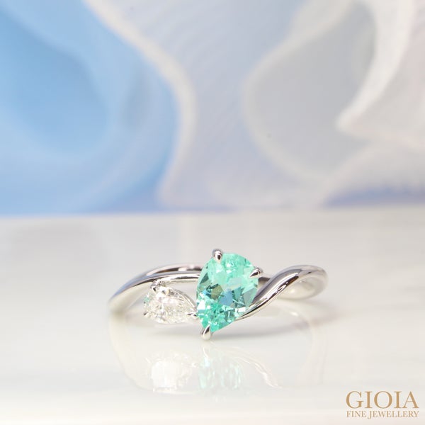 Dual Paraiba Diamond Proposal Ring Inspired by the idea of center pear Paraiba tourmaline representing the love of your life, the pear diamond representing your best friend.