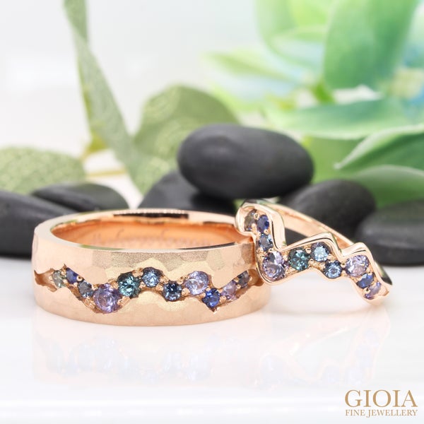 Glacier inspired wedding bands, designed with flow of spinel, sapphire to tanzanite coloured gems. The wedding bands remind both couples of their memorable proposal.