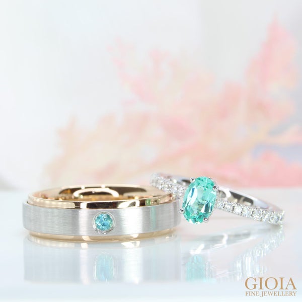 Paraiba Wedding Rings Paraiba engagement ring features a ¾ gradual micro pave diamond giving a full eternity look.