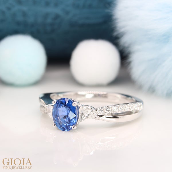 Blue Sapphire Engagement Ring Featuring a blue oval sapphire with side lustrous marquise diamond joint to the infinity micro-pave diamond bands. Heartiest congratulation to Stefen & Andini!