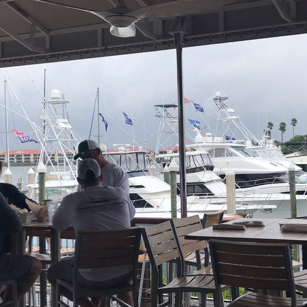 Photo taken at Outriggers Tiki Bar and Grille by Marcie P. on 3/17/2019