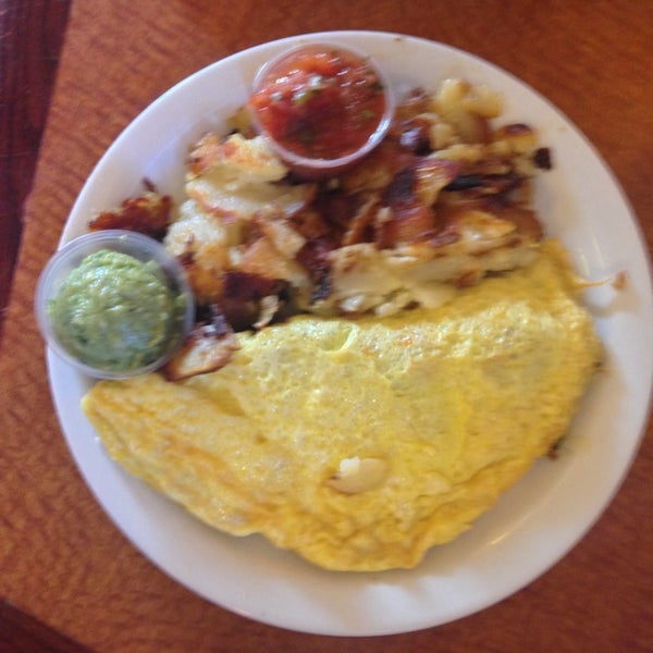 Bring a hearty appetite. Border Check Omelet comes with toast, salsa, guacamole, and choice of hash browns or home fries.
