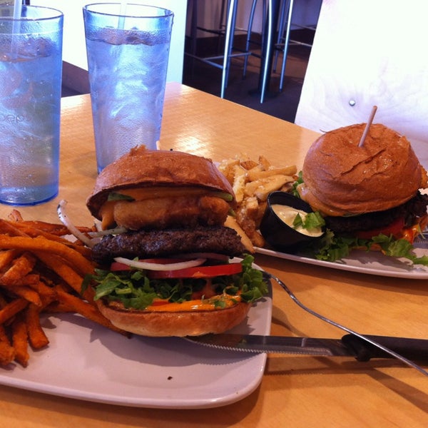 Photo taken at Crave Real Burgers by Ashley Anna on 2/21/2013