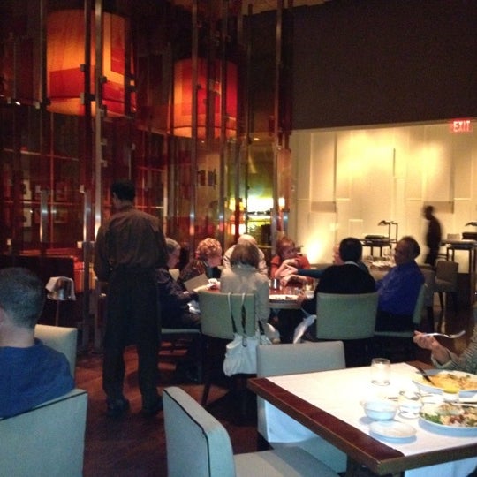 Photo taken at Wolfgang Puck American Grille by Rachna K. on 12/4/2012
