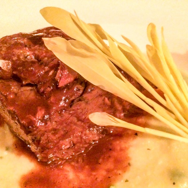 A great place for a date where you can enjoy authentic Italian cuisine & wine in an intimate setting. Save this tip & get the braised beef short ribs w/ polenta. It is fork tender, mouthwatering!