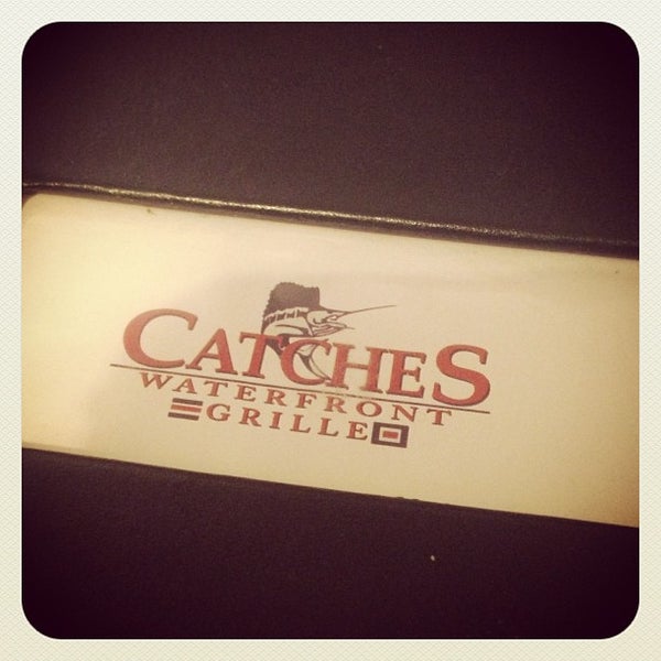 Photo taken at Catches Waterfront Grille by Lizzy S. on 3/23/2013