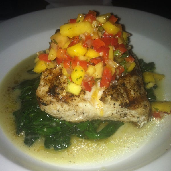 Grilled Mahi Mahi special served with sautéed baby spinach and topped with a fresh mango salsa. Absolutely delicious!
