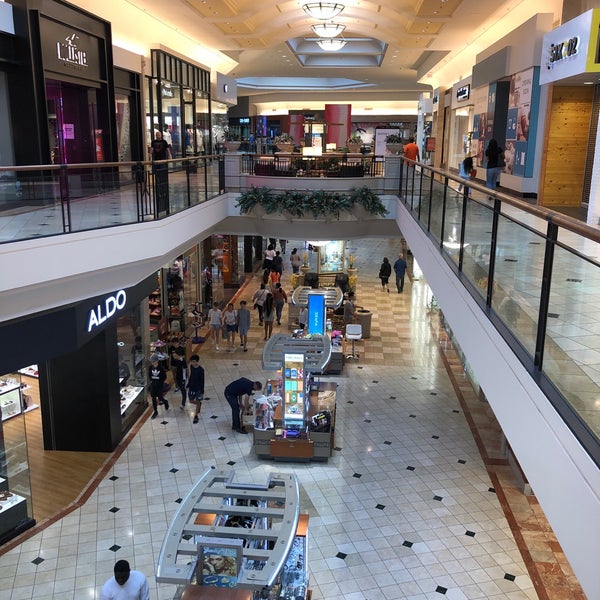 Photo taken at The Mall at Wellington Green by J C. on 6/25/2019