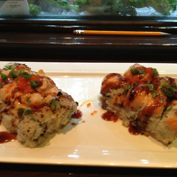 Photo taken at Okura Robata Sushi Bar and Grill by Brandon C. on 4/5/2013