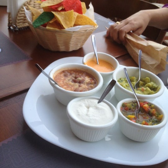 Photo taken at Mucho Gusto Gastronomia Tex-Mex by Olga D. on 12/14/2012