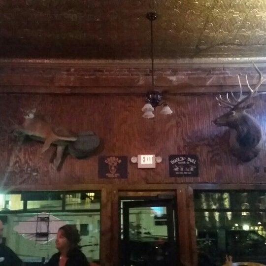 Photo taken at Buglin&#39; Bull Restaurant and Sports Bar by Robert on 7/10/2016