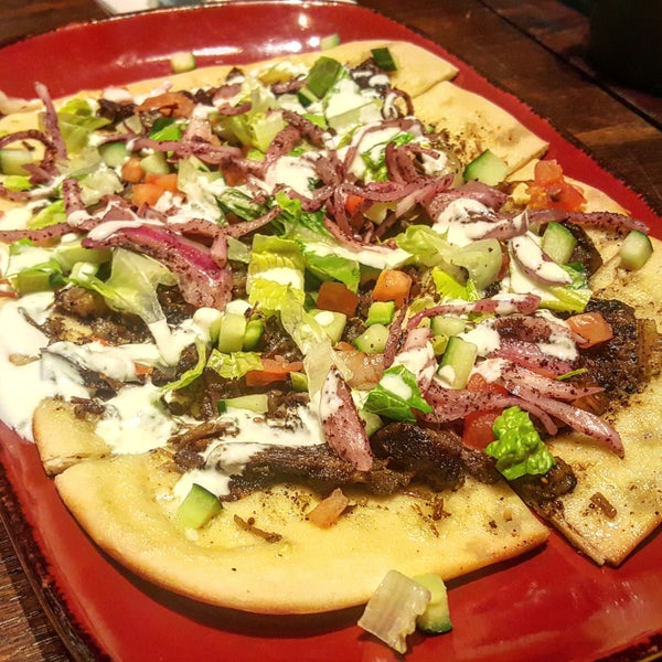 Get the flavorful Lamb Flatbread and wash it down with one of their signature cocktails.
