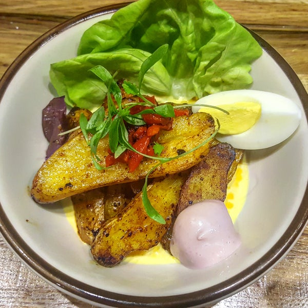The Potatoes in Cream Sauce is the perfect bar snack while waiting for your table at. Roasted fingerling potatoes, huancaina sauce, boiled egg, Peruvian olive, & micro cilantro.
