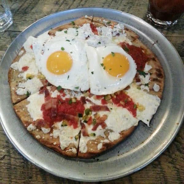 This place has a great brunch menu, I recommend the Breakfast Pizza that's topped with eggs, bacon and vegetables with a delicious crispy crust!