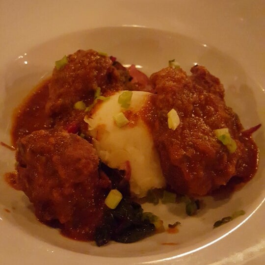 Really delicious and succulent Crispy Pork Cheeks at served with pan gravy and mashed potatoes.