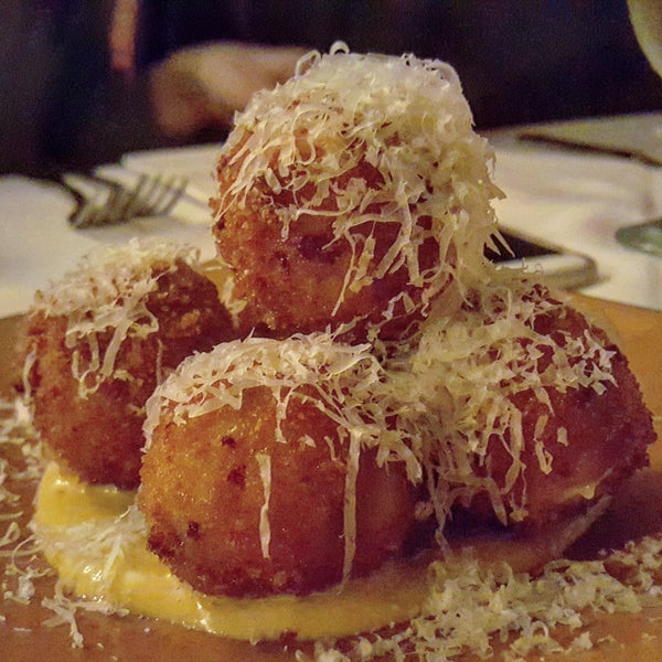The Arancini with sundried tomatoes, mozzarella, sweet sausage, & smoked garlic aioli are just what you're looking for!