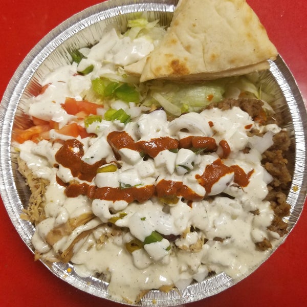 Go for the Combo Chicken & Gyro Platter with plenty of white sauce but beware the deceptively spicy hot sauce!