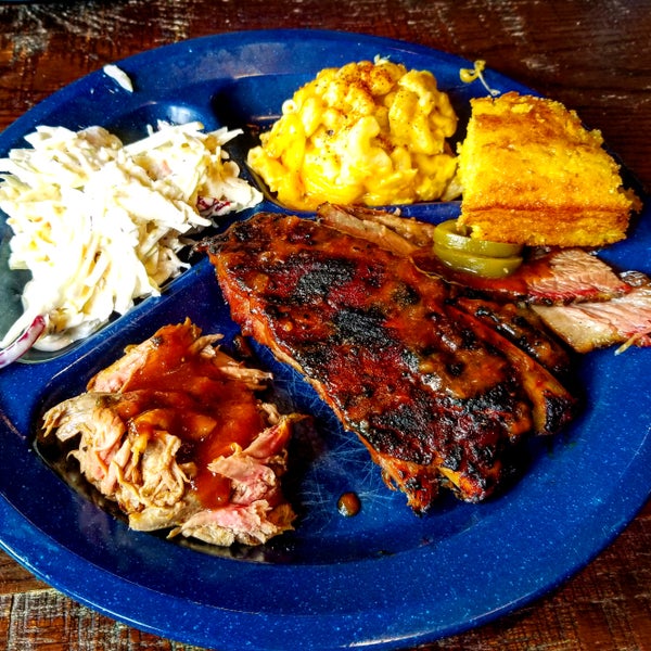 Don't worry if you can't choose just one item, rather feast on the meaty Tres Niños sampler at featuring brisket, ribs,and pork accompanied with coleslaw, mac & cheese, and cornbread.
