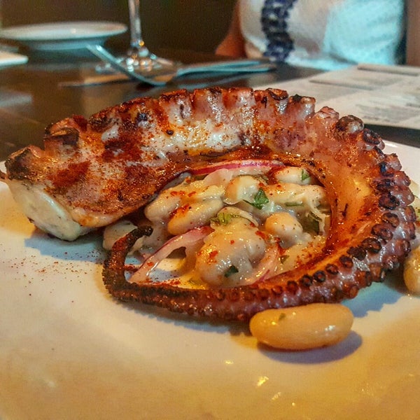 The Grilled Spanish Octopus has a great charred flavor and it's served with cannellini beans, red onion, & pimenton de la vera.