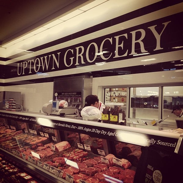 Photo taken at Uptown Grocery Co. by Gina M. on 12/18/2012