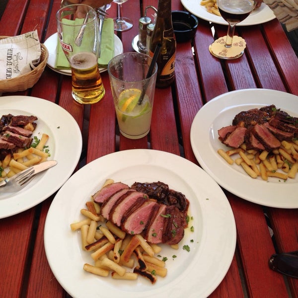 Photo taken at Oliva Restaurant by Andras K. on 7/18/2014