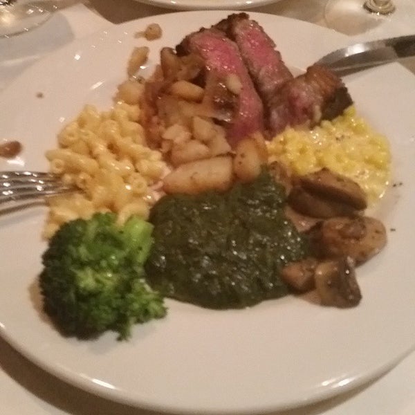 Photo taken at Angus Club Steakhouse by george k. on 12/9/2014