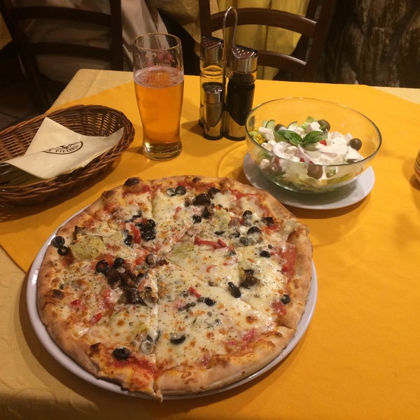 Photo taken at SICILIA Ristorante Pizzeria by Roberto V. on 6/18/2015