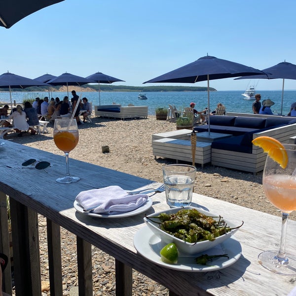 Photo taken at Navy Beach Restaurant by Georgiana M. on 6/6/2021