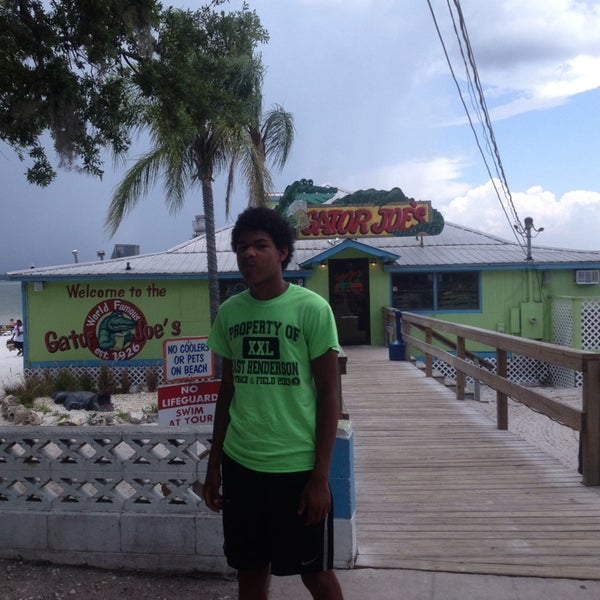 Photo taken at Gator Joe&#39;s Beach Bar &amp; Grill by Mike S. on 6/18/2013