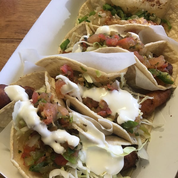 Made fresh to order. You add the salsa and crema(sour cream). There is only street parking. The potato taco is good but you come here for the fish tacos.