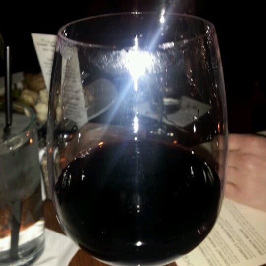 Photo taken at Wine Dive by Katie R. on 12/31/2012