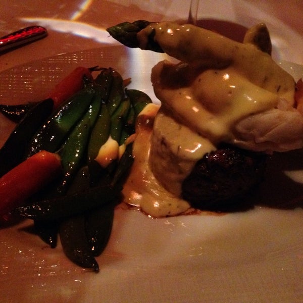 Photo taken at Russell&#39;s Steaks, Chops, &amp; More by Sam W. on 4/22/2014