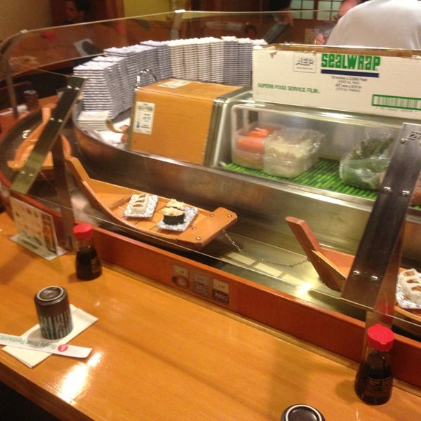 Photo taken at Sushi Boat by Katie G. on 3/21/2013
