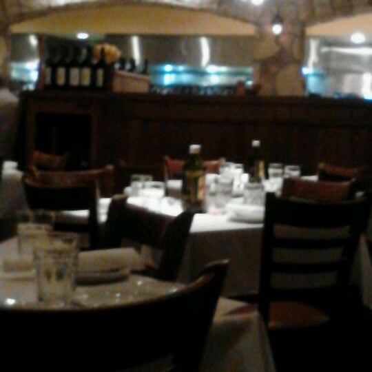 Photo taken at Romano&#39;s Macaroni Grill by Jessica O. on 5/8/2012