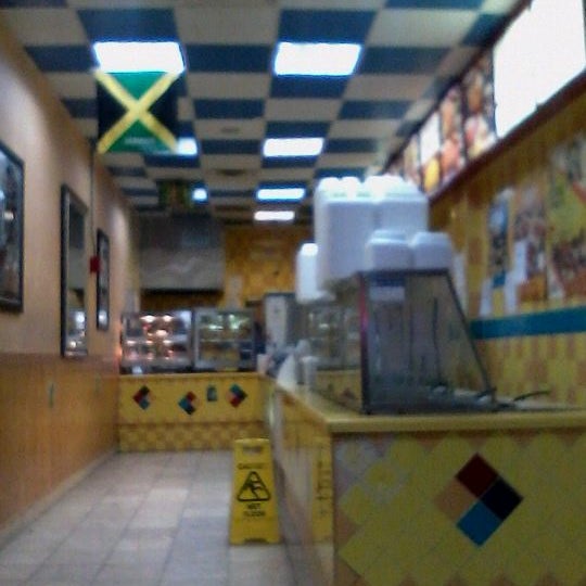 Photo taken at Golden Krust Caribbean Restaurant by Maria A. on 11/29/2011