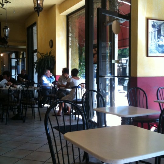 Photo taken at Elysee Café &amp; Bakery by Emma S. on 8/3/2011