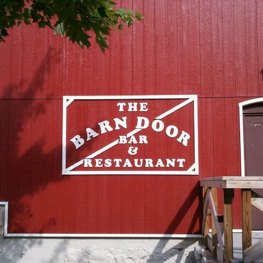 Photo taken at The Barn Door Bar &amp; Restaurant by Stan F. on 9/3/2011