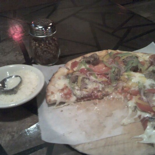Photo taken at SoLo Wood-Fired Pizza by John S. on 10/4/2011
