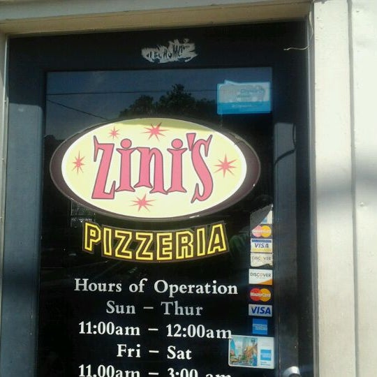 Photo taken at Zini&#39;s Pizzeria by michael h. on 4/7/2012