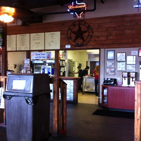 Photo taken at Moonies Burger House by Teresa C. on 7/13/2012