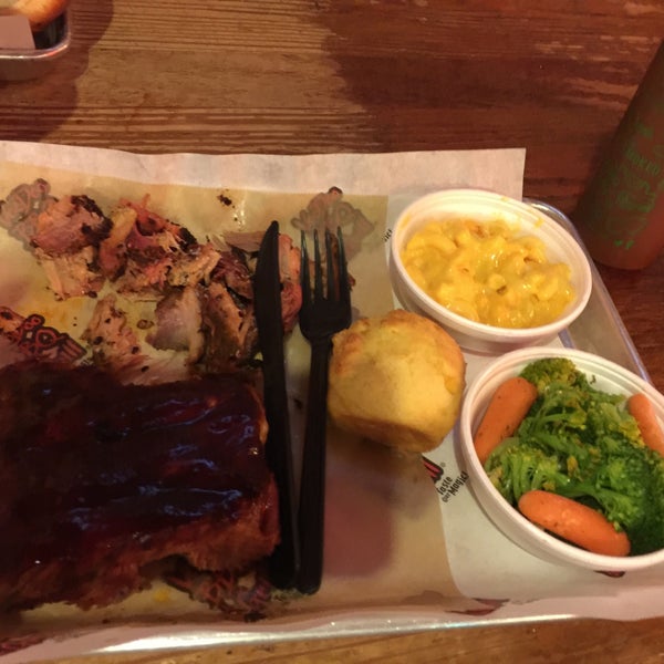 Photo taken at VooDoo BBQ &amp; Grill Uptown by Ben R. on 3/11/2016