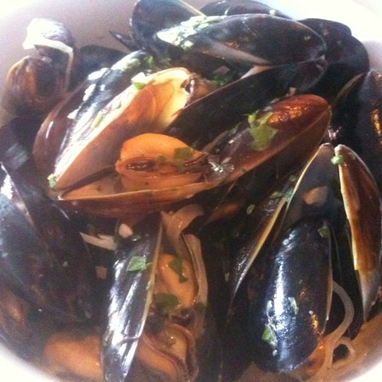 Try the mussels in white wine/garlic sauce (moules poulette) with fries.  It's yummmm!!