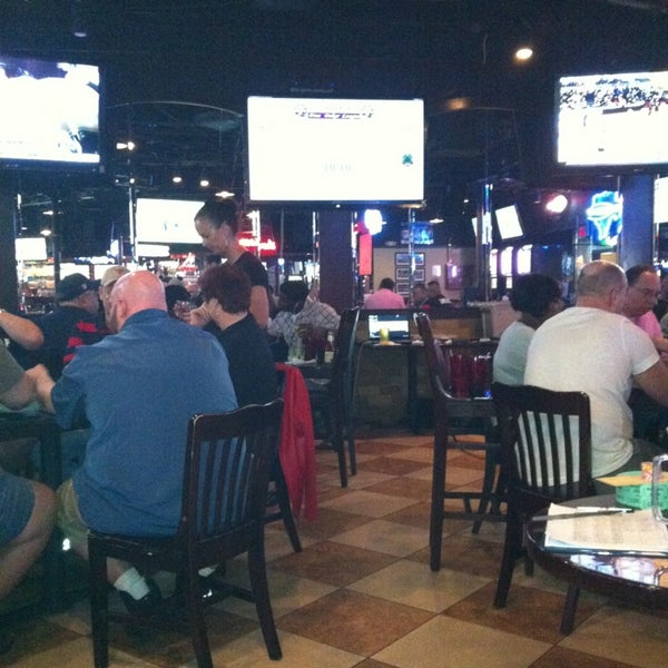 Photo taken at Coaches Sports Bar &amp; Grill by Sandy G. on 2/2/2013