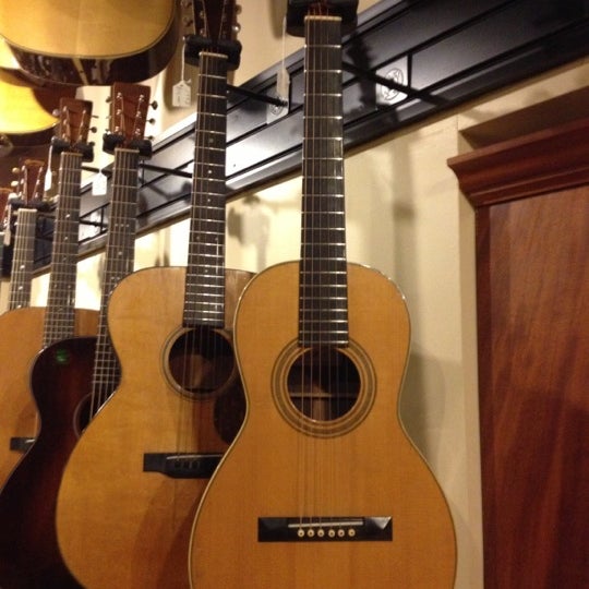Photo taken at Gruhn Guitars by Doug C. on 11/15/2012