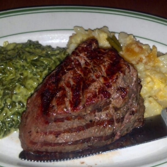 Photo taken at Izzy&#39;s Steaks &amp; Chops by Benjamin K. on 3/22/2013