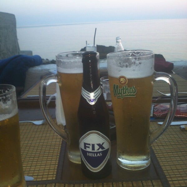 Photo taken at Black Rocks Seaside Restaurant by Kostas G. on 8/7/2013