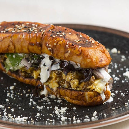 Classic Latin fare gets a brunch makeover with options such as breakfast tacos or an arepa topped with steak, eggs, peanut-chili sauce, mushrooms, peanuts and pickled vegetables.
